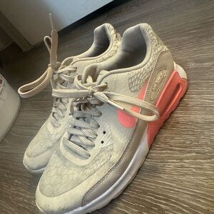 Nike Gray and Pink Sneakers with Modern Design and Cushioned Sole
